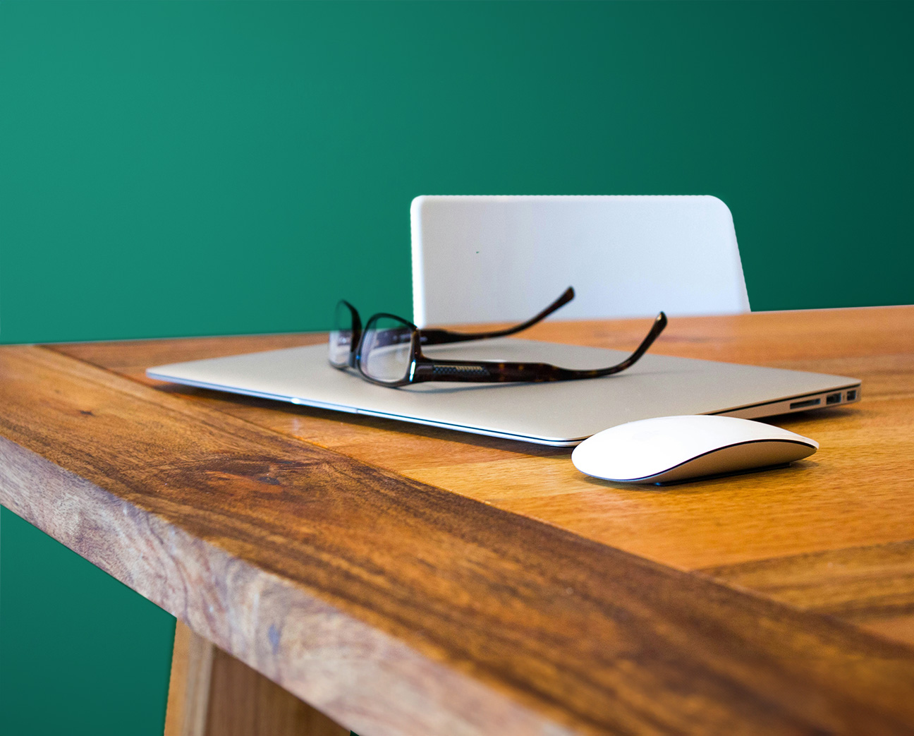 Reading glasses on a desk, accessible tech help